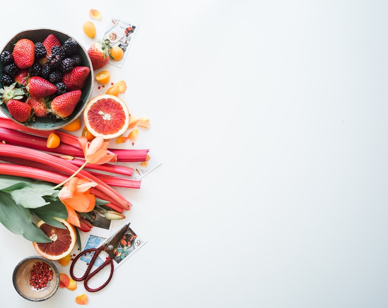 Fresh fruit and vegetables arranged on dark surface